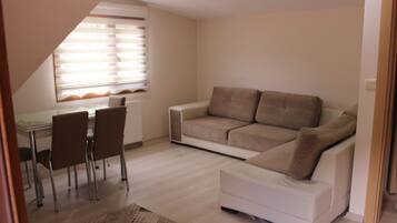 Panoramic Apartment | Living area | 40-inch LED TV with satellite channels