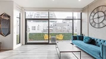 Executive Apartment | Living room | 55-inch Smart TV with digital channels, TV, Netflix