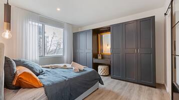 Executive Apartment | 2 bedrooms, blackout curtains, iron/ironing board, free WiFi