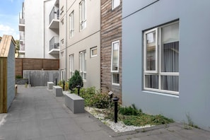 Situated in a quiet neighborhood, this building offers a clean and minimalist design with large windows and balconies.