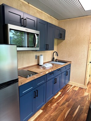 Fridge, microwave, stovetop, coffee/tea maker