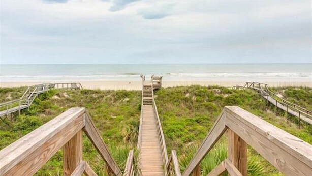 A wooden boardwalk leading to a beach with a clear view of the ocean. - Pelican Inlet C218 2 Bedroom Condo by RedAwning (St. Augustine)