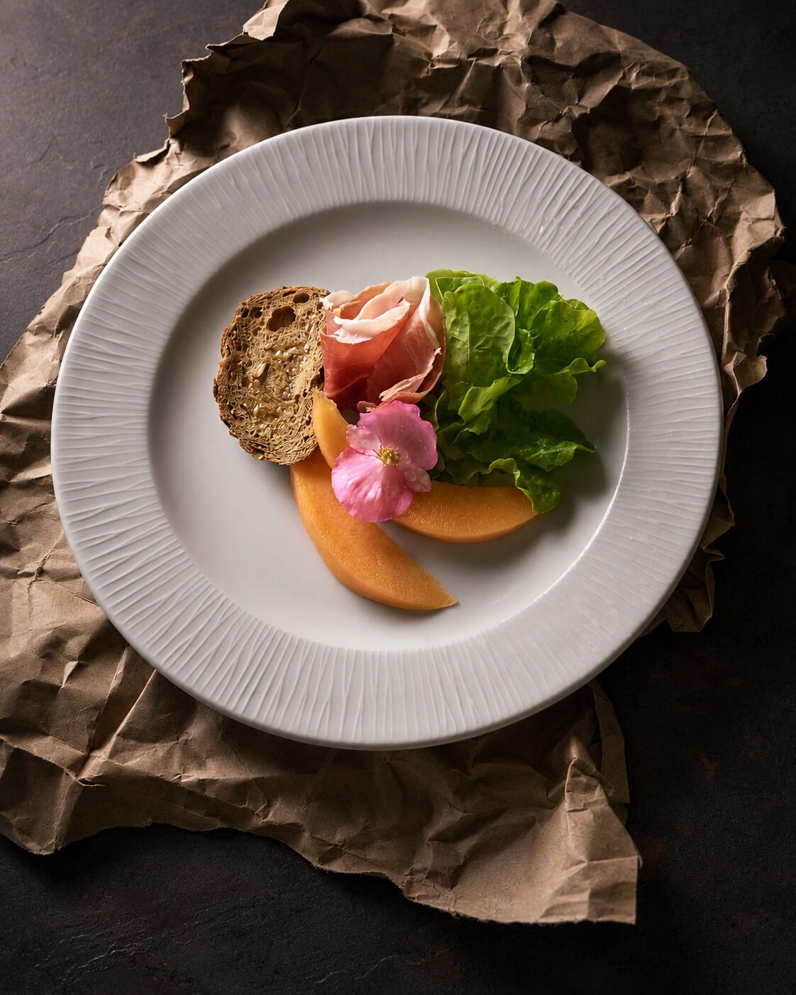 A plate with food items on a table.