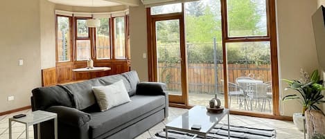 Family Apartment, 1 Bedroom, Courtyard Area | Living area | Smart TV, heated floors