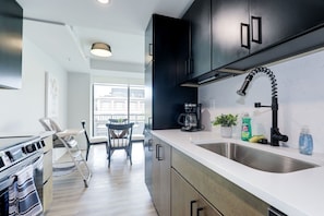 Fridge, microwave, oven, stovetop - 2BR Executive Apartment by Envitae (Arlington)