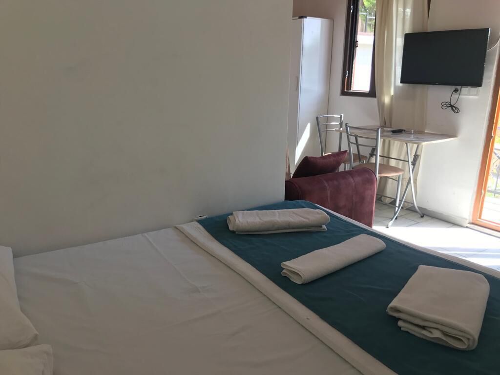 Desk, laptop workspace, bed sheets