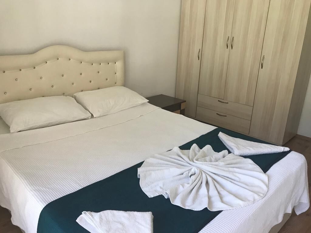 Desk, laptop workspace, bed sheets
