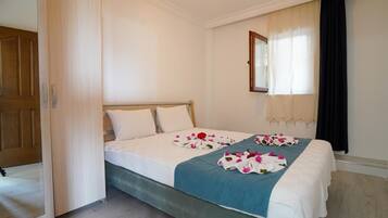 Desk, laptop workspace, bed sheets