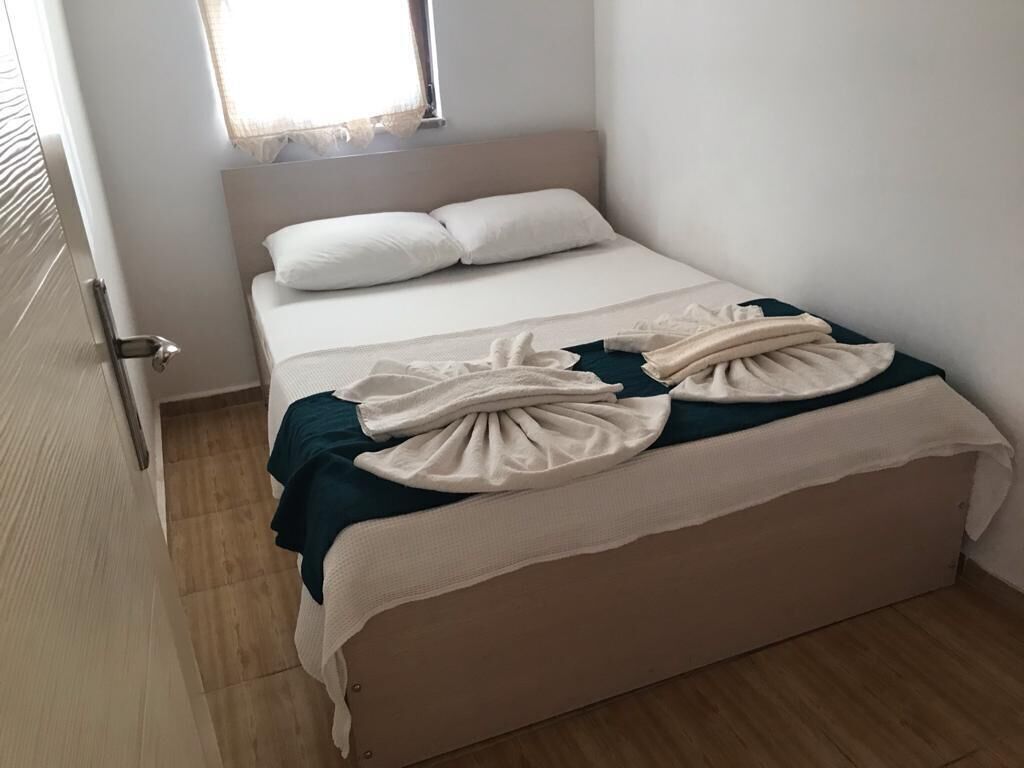 Desk, laptop workspace, bed sheets