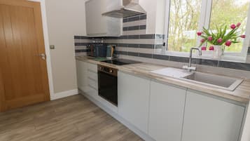 Fridge, electric kettle, toaster, cookware/dishes/utensils