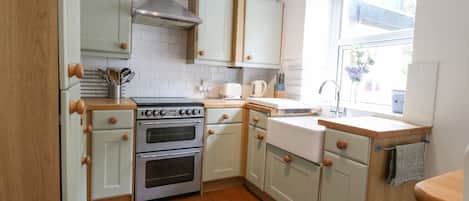 Fridge, electric kettle, toaster, cookware/dishes/utensils