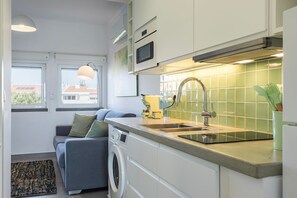 Fridge, microwave, stovetop, coffee/tea maker