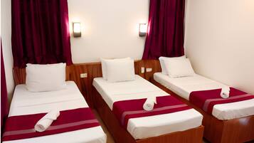 Superior Room, 3 Twin Beds, Non Smoking, Private Bathroom | 1 bedroom, individually decorated, individually furnished, desk