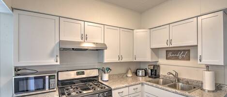 Fridge, coffee/tea maker, cookware/dishes/utensils, dining tables