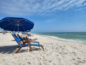 On the beach, sun loungers, beach towels