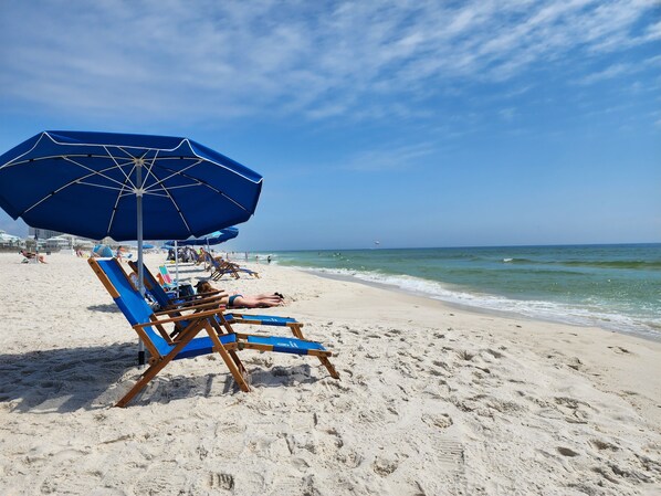 On the beach, sun-loungers, beach towels