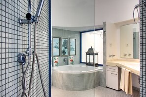 Shower, hair dryer, towels, toilet paper