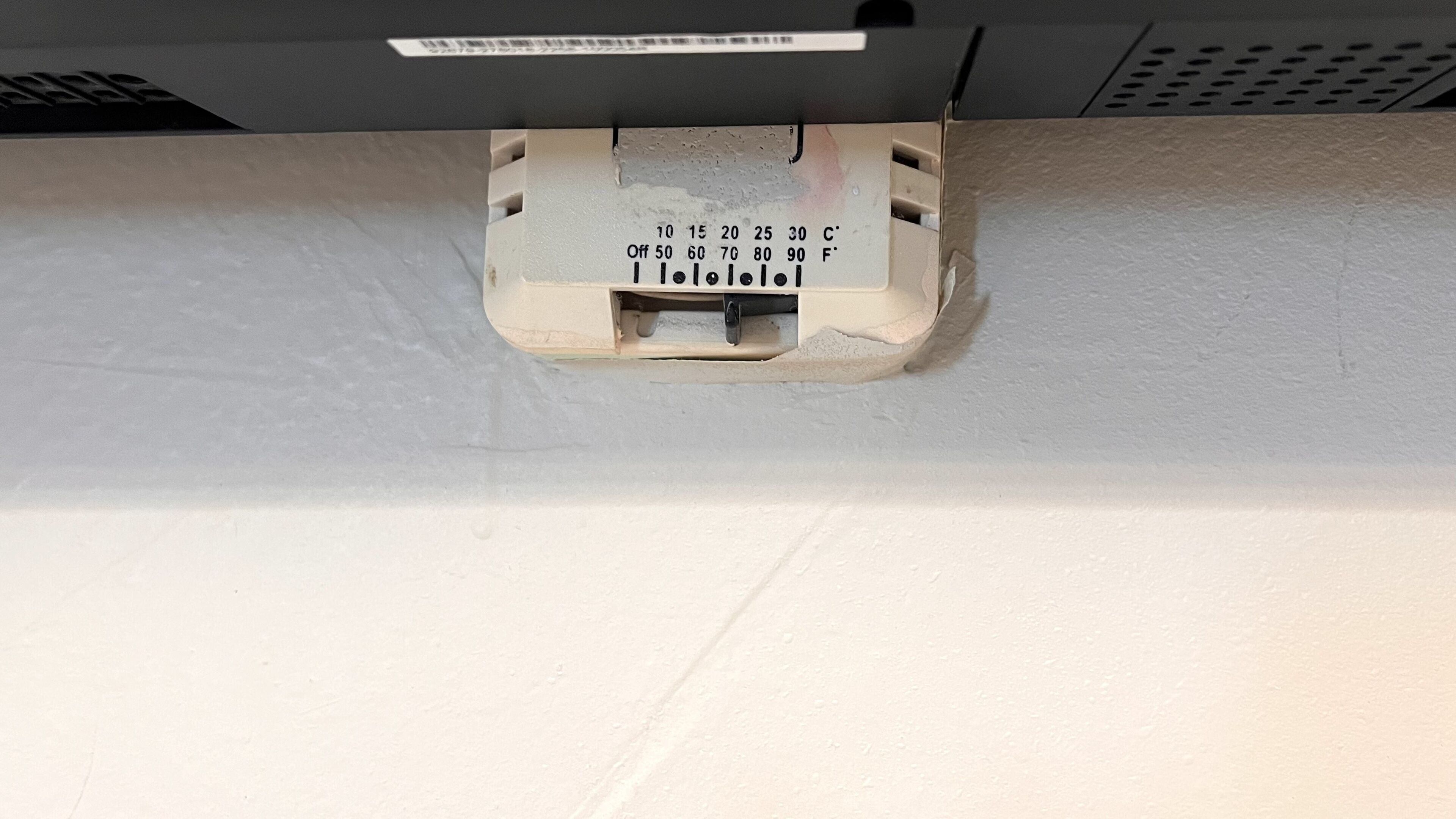 A thermostat with temperature settings and a label reading "I love you!"