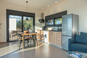 Fridge, coffee/tea maker, cookware/dishes/utensils, paper towels