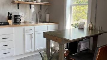 Microwave, coffee/tea maker, cookware/dishes/utensils