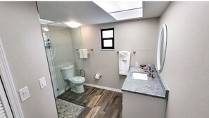 Shower, hair dryer, towels, toilet paper