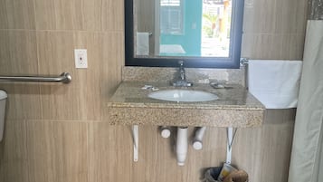 Separate bathtub and shower, jetted bath, towels