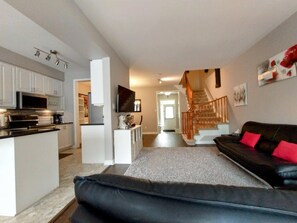 Smart TV, fireplace, books, computer monitors