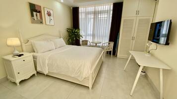 Kondominium Klasik, 1 Tempat Tidur Queen, pemandangan halaman | 1 kamar tidur, setrika/meja setrika, dan Wi-Fi gratis