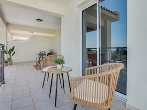 Enjoy dining or socializing on the balcony with a clear view of the surrounding landscape.