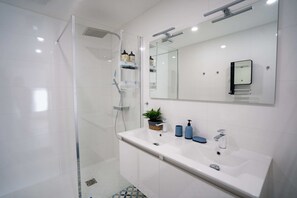Shower, hair dryer, towels, soap