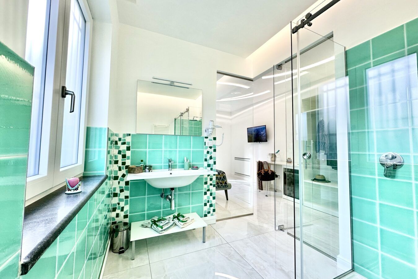 Deluxe kamer | Badkamer | Gratis toiletartikelen, een haardroger