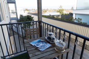 Outdoor dining - Luxury Couples Retreat Beach Front Apt with Ocean View Balcony (Glenelg North)