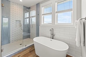 Bathtub, hair dryer, towels