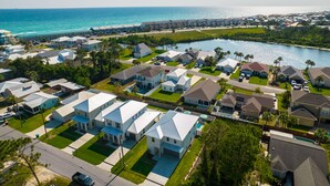 A residential area with houses, a marina, and a beach. - Dancing Heron - West End PCB, Pool + Golf Cart 🛺, Sleeps 12 (Panama City Beach)
