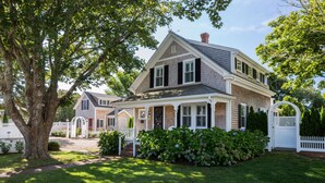 A two-story house with a front porch, a brick facade, and a large tree in the yard. - Stroll Chatham's Historic Downtown / Shops, Dining, Galleries, Etc. (Chatham)