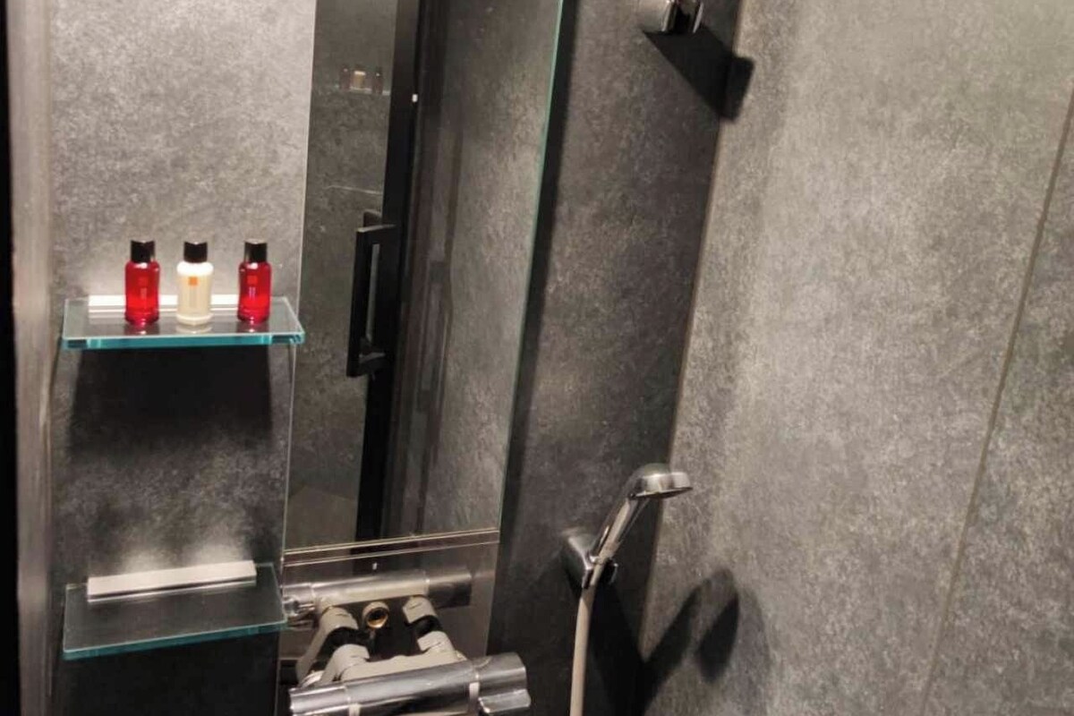 Bathroom | Hair dryer, slippers, towels, shampoo