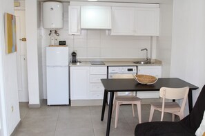 Fridge, microwave, coffee/tea maker, cookware/dishes/utensils