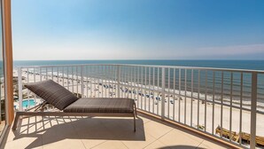 A balcony with a view of a beach and ocean. - Phoenix Gulf Towers 904 4 Bedroom Condo (Orange Beach)