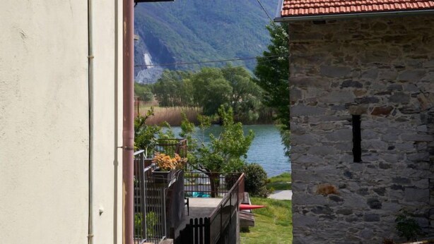 A stone building with a view of a lake and mountains. - Casa Dascio by Interhome (Sorico Albonico)