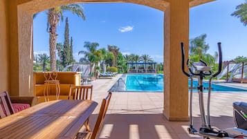 Deluxe Villa, 6 Bedrooms, Private Bathroom, Pool View | Living area | 32-inch Smart TV with satellite channels, TV, books