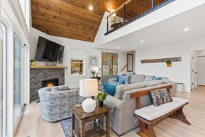 Smart TV, fireplace, books, printers