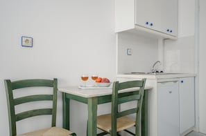 Studio, 2 Twin Beds, Private Bathroom | Private kitchen | Fridge, cookware/dishes/utensils, cleaning supplies - Nostos Studios (Naxos)