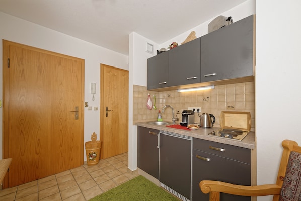 Fridge, microwave, stovetop, coffee/tea maker
