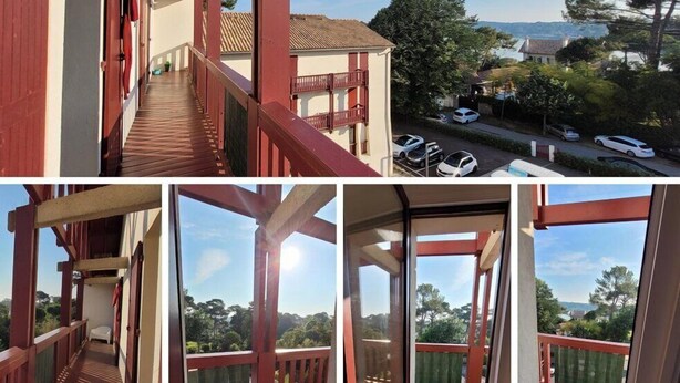 A multi-level building with balconies, a wooden deck, and a view of parked cars and trees. - La riviéra" apartment. (HOSSEGOR)