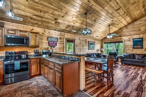 Fridge, microwave, oven, stovetop - Family Retreat - HotTub! Theater! FirePit! Wifi! Grill! Jacuzzi in both bedrooms (Pigeon Forge)