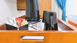 A tray with a coffee maker, two mugs, and a box of tea bags. - Le Riad Giza Pyramids Hotel (Giza)