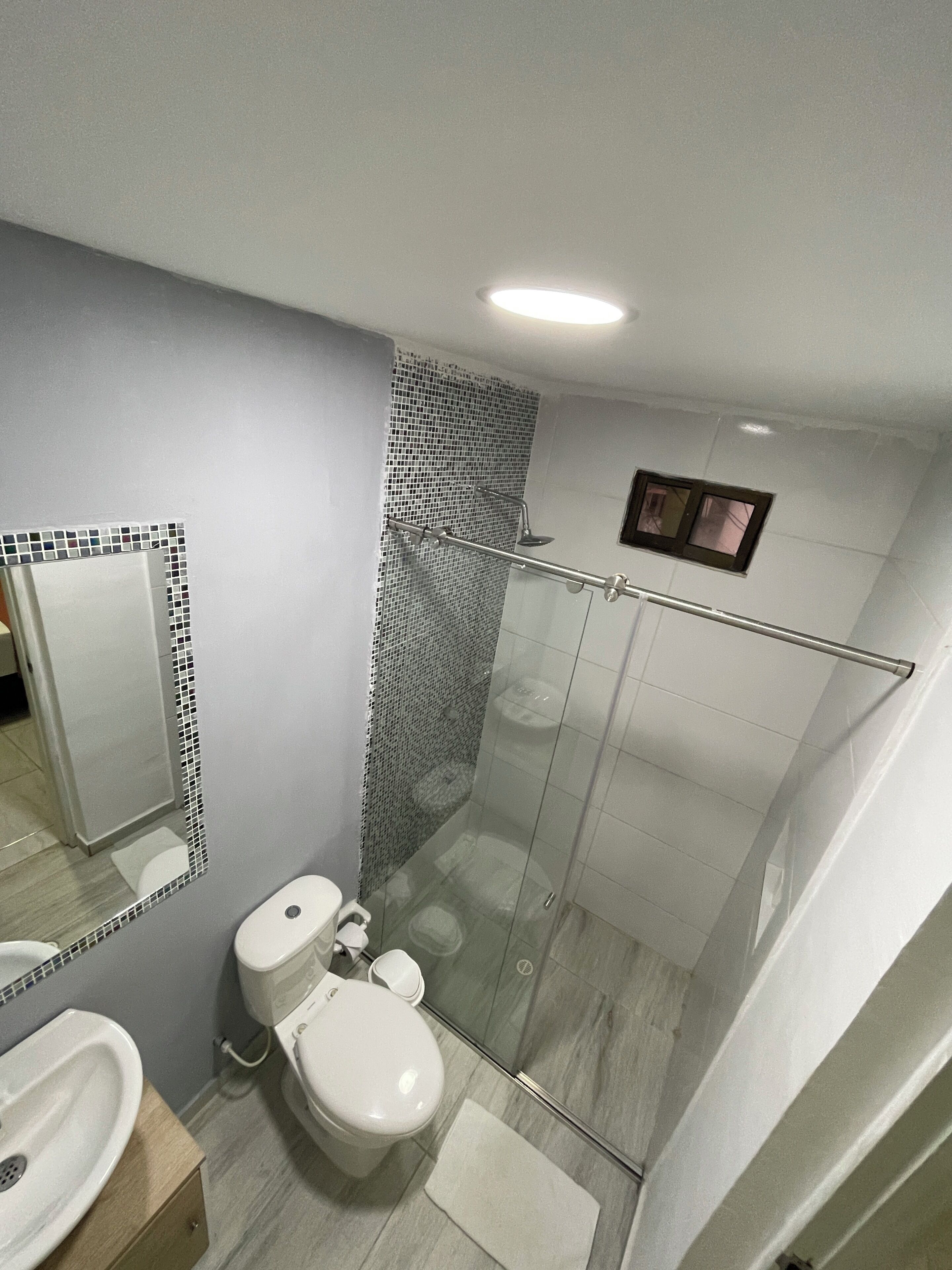 Shower, rainfall showerhead, towels, soap