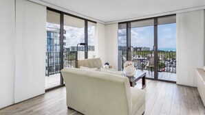 A spacious balcony with a view of the city and ocean. - Ocean Views in Our House at the Beach, Full Gulf Views from Balcony, Heated Pools! (Siesta Key)