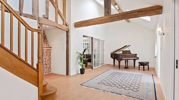 Family House, Multiple Beds | Living area | 32-inch flat-screen TV with cable channels, table football