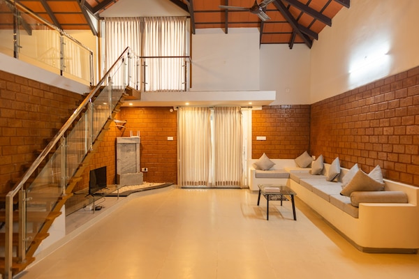 Villa Premium, 2 habitaciones, alberca privada, vista al jardín | Área de sala de estar